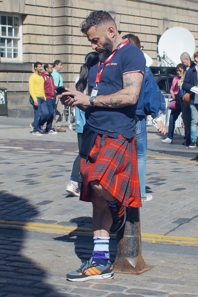 Trader taking a break. Love the kilt, the tattoos and the footwear. flickr-28838022776.jpg